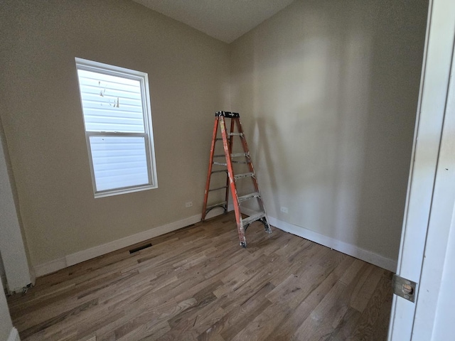 426 N Trumbull Ave, Chicago, IL 60624 - unfurnished bedroom featuring wood finished floors and baseboards