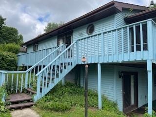 71 Delburne Dr, Davis, IL 61019 - view of side of property featuring a deck and stairs