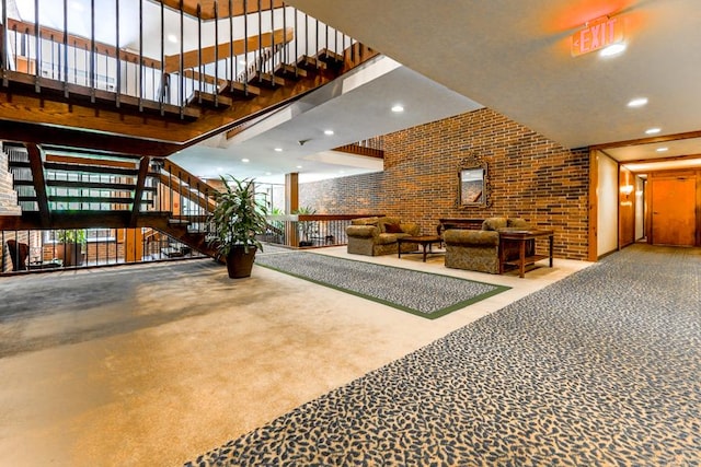 1401 Burr Oak Rd Unit 108B, Hinsdale, IL 60521 - lobby with a towering ceiling, brick wall, stairs, and recessed lighting