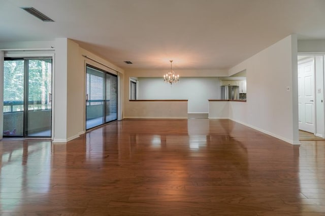 1401 Burr Oak Rd Unit 108B, Hinsdale, IL 60521 - unfurnished living room featuring a chandelier and wood finished floors