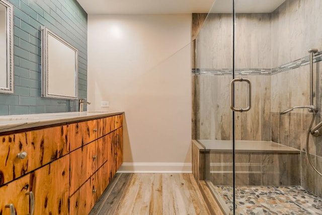 1401 Burr Oak Rd Unit 108B, Hinsdale, IL 60521 - full bath featuring double vanity, a shower stall, and wood finished floors