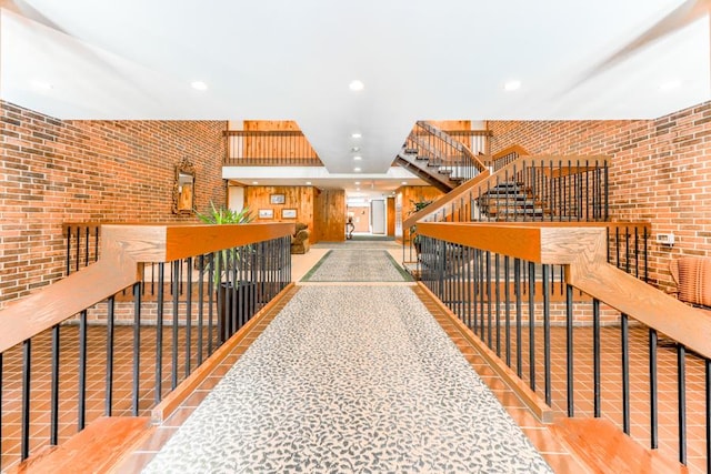 1401 Burr Oak Rd Unit 108B, Hinsdale, IL 60521 - hall with an upstairs landing, brick wall, and recessed lighting