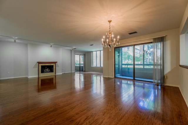 1401 Burr Oak Rd Unit 108B, Hinsdale, IL 60521 - unfurnished living room with a chandelier, a fireplace, and dark wood-type flooring