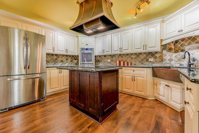 1401 Burr Oak Rd Unit 108B, Hinsdale, IL 60521 - kitchen with freestanding refrigerator, custom exhaust hood, dark stone countertops, and decorative backsplash
