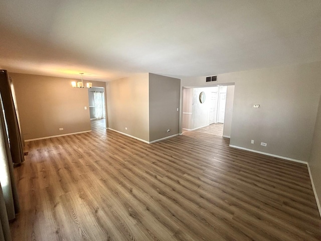 2S651 Ashley Dr, Glen Ellyn, IL 60137 - spare room featuring a chandelier and wood finished floors