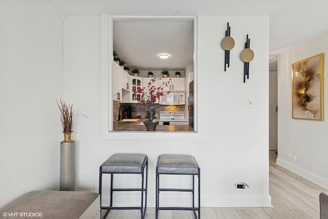111 E Chestnut St Unit 21B, Chicago, IL 60611 - detailed view of white appliances and wood finished floors