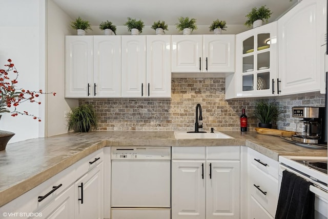 111 E Chestnut St Unit 21B, Chicago, IL 60611 - kitchen featuring white dishwasher, glass insert cabinets, white cabinetry, and tasteful backsplash