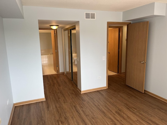 2020 Saint Regis Dr Unit 501, Lombard, IL 60148 - unfurnished room featuring dark wood-type flooring and baseboards
