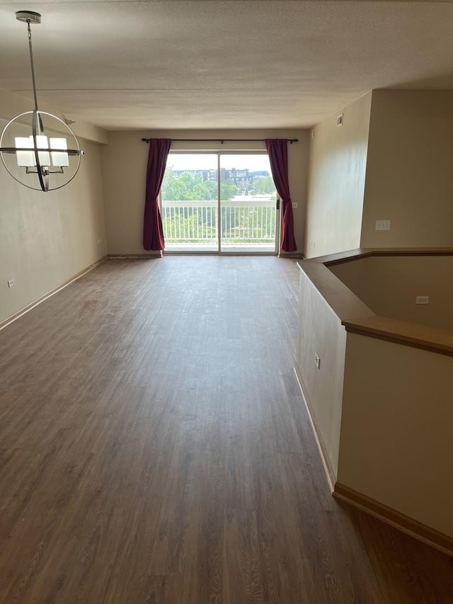 2020 Saint Regis Dr Unit 501, Lombard, IL 60148 - empty room featuring a chandelier and dark wood-style flooring