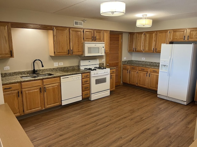 2020 Saint Regis Dr Unit 501, Lombard, IL 60148 - kitchen with white appliances, dark wood finished floors, brown cabinetry, and dark countertops
