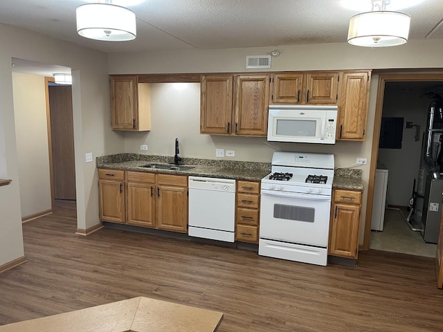 2020 Saint Regis Dr Unit 501, Lombard, IL 60148 - kitchen with white appliances, dark wood finished floors, brown cabinetry, and pendant lighting