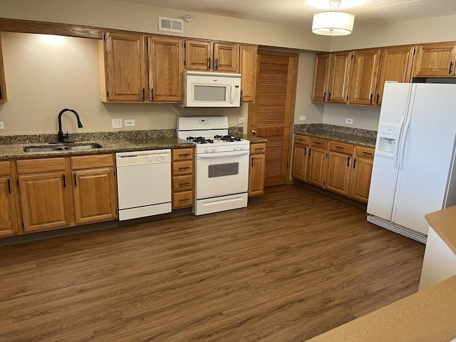 2020 Saint Regis Dr Unit 501, Lombard, IL 60148 - kitchen with white appliances, dark wood-type flooring, and brown cabinetry
