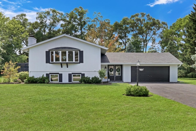 31340 N Liberty Rd, Grayslake, IL 60030 - split level home with driveway, a garage, a chimney, and a front lawn