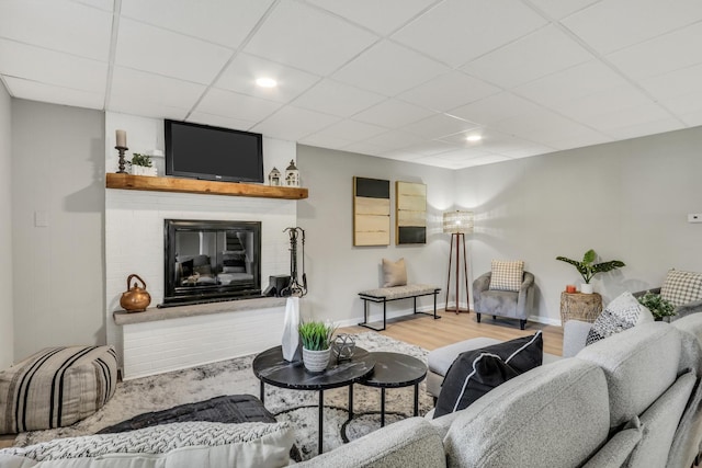 31340 N Liberty Rd, Grayslake, IL 60030 - living area featuring a paneled ceiling, wood finished floors, and a fireplace