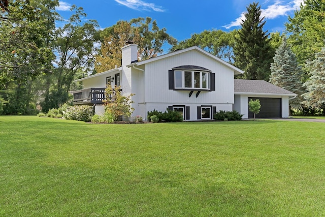 31340 N Liberty Rd, Grayslake, IL 60030 - view of front of home featuring a chimney, a garage, a front yard, and driveway