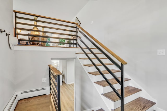 31340 N Liberty Rd, Grayslake, IL 60030 - staircase with a baseboard radiator, wood finished floors, and a high ceiling