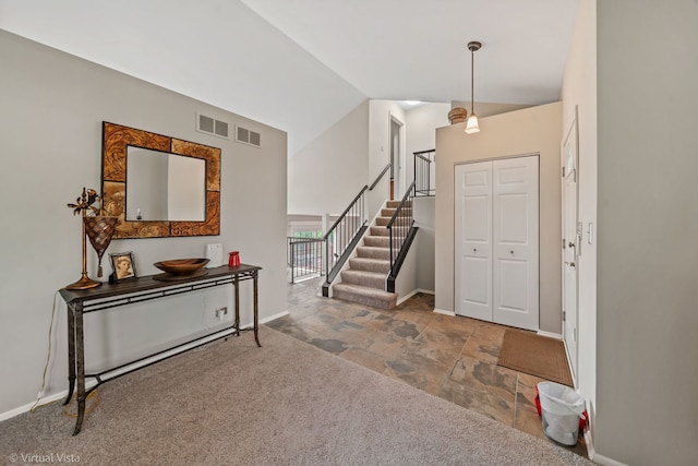 2243 Camden Ln, Hanover Park, IL 60133 - foyer with stone finish flooring, stairway, and high vaulted ceiling