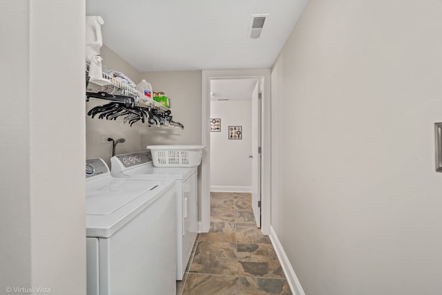 2243 Camden Ln, Hanover Park, IL 60133 - laundry area with washing machine and dryer and stone finish flooring