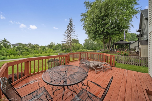 2243 Camden Ln, Hanover Park, IL 60133 - wooden deck featuring outdoor dining space and a gazebo