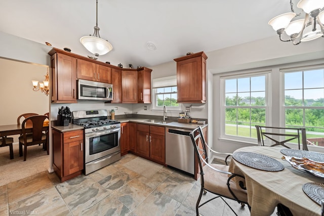 2243 Camden Ln, Hanover Park, IL 60133 - kitchen featuring appliances with stainless steel finishes, a chandelier, and brown cabinets