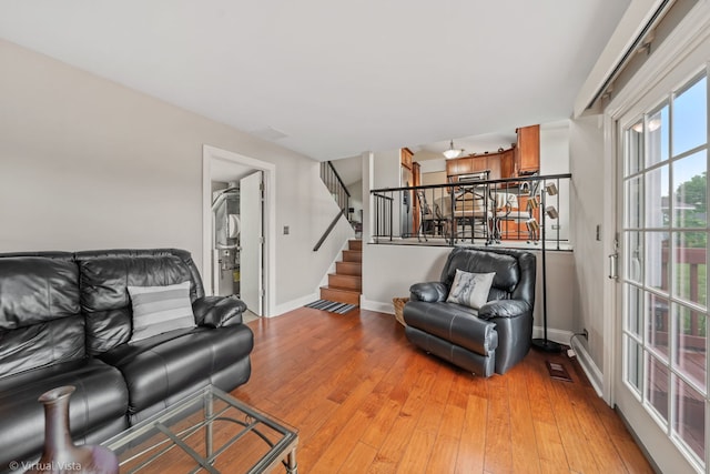 2243 Camden Ln, Hanover Park, IL 60133 - living room with light wood-style floors and stairs