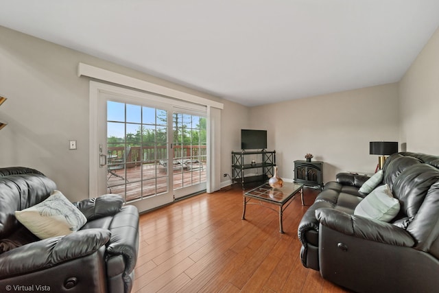 2243 Camden Ln, Hanover Park, IL 60133 - living area featuring a wood stove and wood finished floors