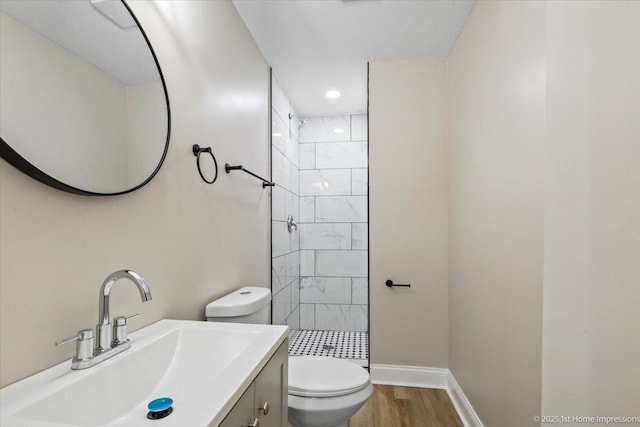 214 Marquette St, Park Forest, IL 60466 - bathroom with a tile shower, wood finished floors, vanity, and recessed lighting