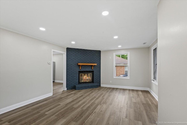 214 Marquette St, Park Forest, IL 60466 - unfurnished living room with wood finished floors, recessed lighting, a brick fireplace, and ornamental molding