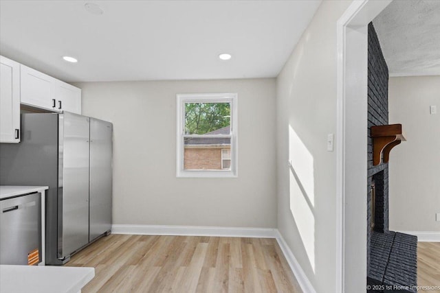 214 Marquette St, Park Forest, IL 60466 - kitchen with light wood finished floors, white cabinetry, appliances with stainless steel finishes, light countertops, and recessed lighting