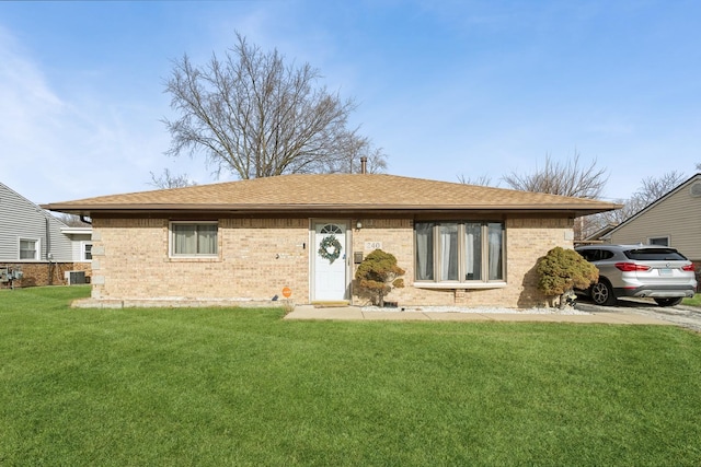 240 Miami St, Park Forest, IL 60466 - ranch-style house with brick siding, a front yard, and roof with shingles