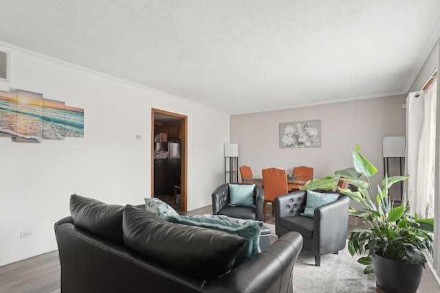 240 Miami St, Park Forest, IL 60466 - living area with ornamental molding, wood finished floors, and a textured ceiling