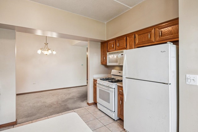 6514 Pine Trail Ln Unit 2, Tinley Park, IL 60477 - kitchen with white appliances, light carpet, a chandelier, brown cabinetry, and light tile patterned floors