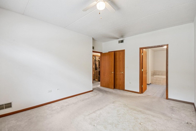 6514 Pine Trail Ln Unit 2, Tinley Park, IL 60477 - unfurnished bedroom with carpet, ensuite bathroom, a closet, and a ceiling fan
