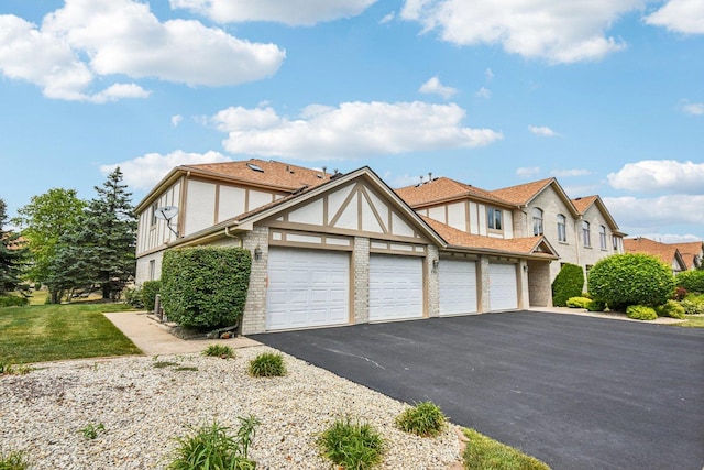 6514 Pine Trail Ln Unit 2, Tinley Park, IL 60477 - english style home with driveway, a garage, and stucco siding