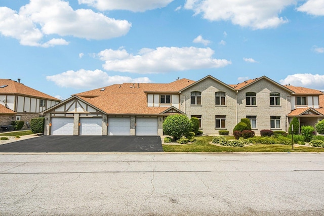 6514 Pine Trail Ln Unit 2, Tinley Park, IL 60477 - view of front of property with asphalt driveway and an attached garage