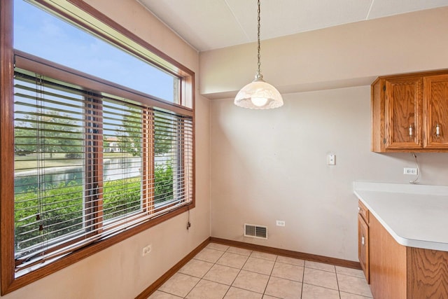 6514 Pine Trail Ln Unit 2, Tinley Park, IL 60477 - unfurnished dining area with baseboards and light tile patterned flooring