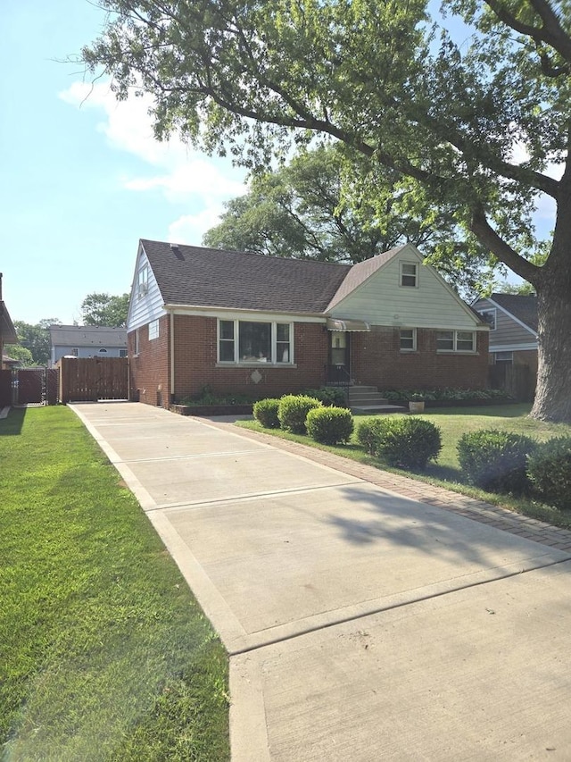 452 S Walnut St, Bensenville, IL 60106 - view of front facade featuring concrete driveway and brick siding