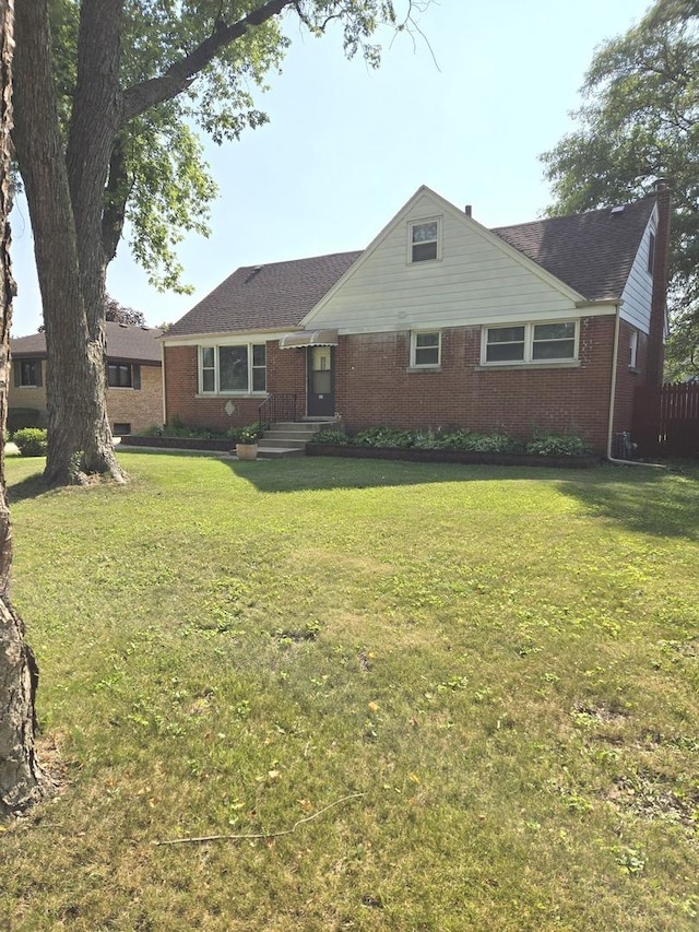 452 S Walnut St, Bensenville, IL 60106 - view of front of home with brick siding and a front lawn