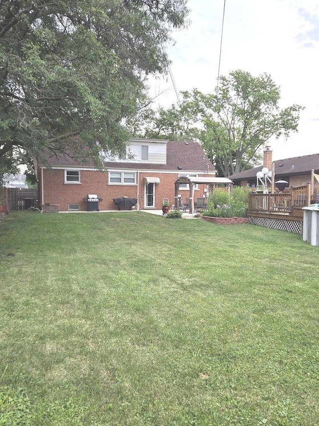452 S Walnut St, Bensenville, IL 60106 - back of property featuring a wooden deck and brick siding