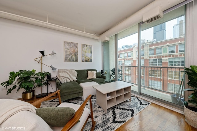700 W Van Buren St Unit 803, Chicago, IL 60607 - living area featuring wood finished floors and a wall mounted AC