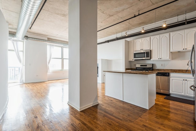 6 S Laflin St Unit 712, Chicago, IL 60607 - kitchen featuring stainless steel appliances, dark wood-type flooring, and white cabinetry