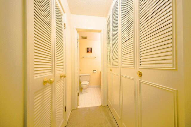 1206 S New Wilke Rd Unit 108, Arlington Heights, IL 60005 - hallway with tile patterned floors