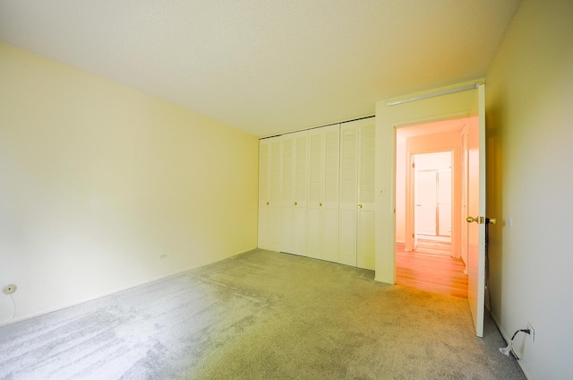 1206 S New Wilke Rd Unit 108, Arlington Heights, IL 60005 - unfurnished bedroom featuring carpet flooring and a closet