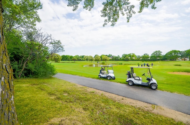 1206 S New Wilke Rd Unit 108, Arlington Heights, IL 60005 - view of property's community featuring view of golf course, a water view, and a yard