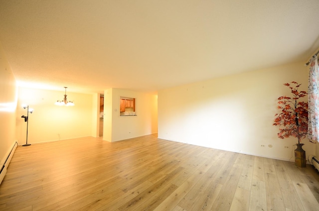 1206 S New Wilke Rd Unit 108, Arlington Heights, IL 60005 - unfurnished room featuring light wood finished floors, a chandelier, and baseboard heating