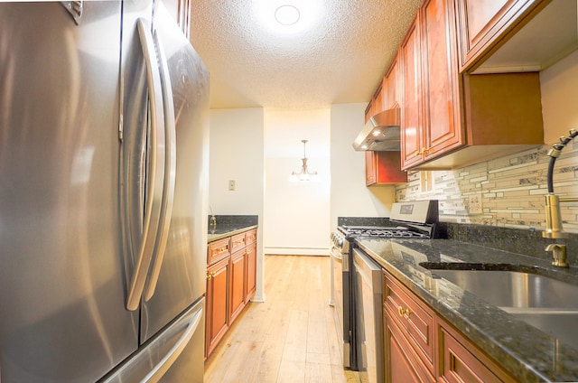 1206 S New Wilke Rd Unit 108, Arlington Heights, IL 60005 - kitchen with stainless steel appliances, under cabinet range hood, light wood-type flooring, tasteful backsplash, and a textured ceiling