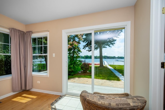 22869 W Lake Shore Dr, Antioch, IL 60002 - doorway to outside featuring plenty of natural light, light wood-style flooring, and a water view