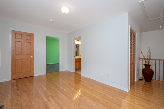 22869 W Lake Shore Dr, Antioch, IL 60002 - empty room featuring light wood finished floors, attic access, and a smoke detector