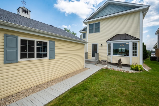 22869 W Lake Shore Dr, Antioch, IL 60002 - rear view of house with a yard and a standing seam roof