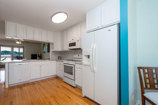 22869 W Lake Shore Dr, Antioch, IL 60002 - kitchen featuring white appliances, white cabinetry, light countertops, and light wood-type flooring